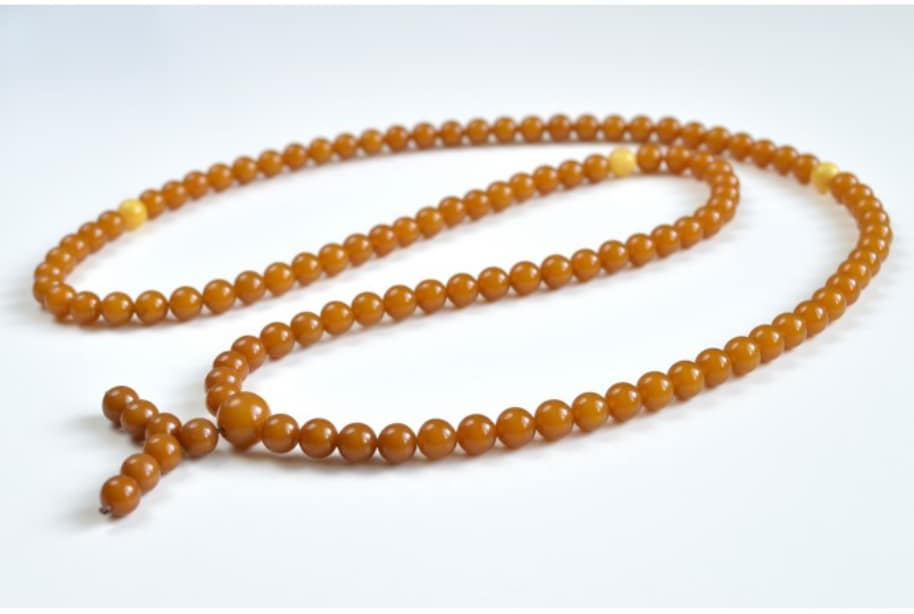 Rosary beads symbolizing ritual chanting without inner understanding, as questioned in Guru Amar Das Ji’s Shabad
